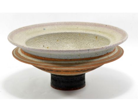 ROBIN WELCH (born 1936); a double rimmed stoneware pedestal bowl, pitted grey glaze with lilac upper rim, impressed mark, dia