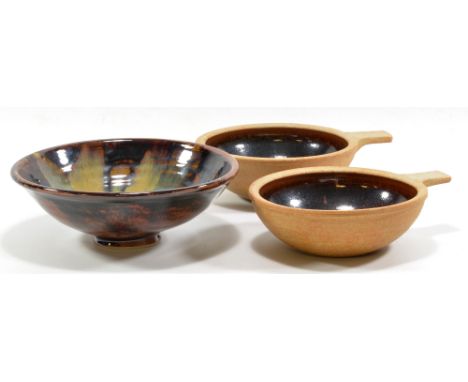 AMANDA BRIER (born 1978) for Leach Pottery; a stoneware bowl with streaky yellow/sea green pours on tenmoku ground, impressed