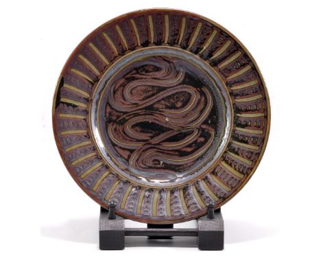 MICHAEL CARDEW (1901-1983) for Abuja Pottery; a stoneware plate with meander decoration, impressed MC and pottery marks, diam
