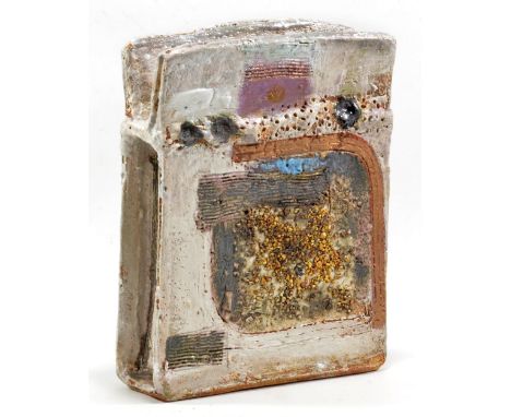 ROBIN WELCH (born 1936); a stoneware rectangular form with fins to top, white glaze with combed and textured polychrome surfa