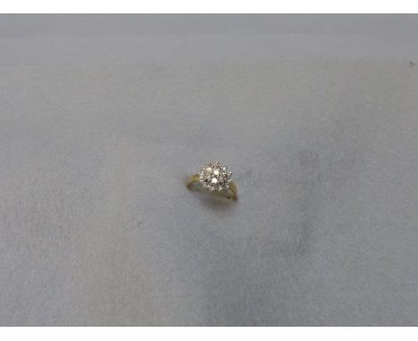 An 18ct gold diamond cluster ring, approximately 1.5 carats, size R/S.