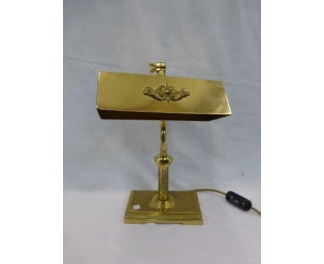 A brass desktop angular lamp. 