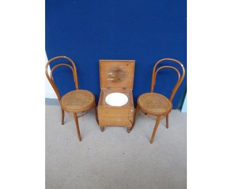 Two bentwood chairs and a pine commode.