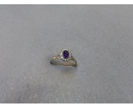 An 18ct gold amethyst and diamond ring, size P. 