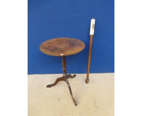 A mahogany cased stick barometer signed Casella and a 19th Century circular mahogany wine table. 