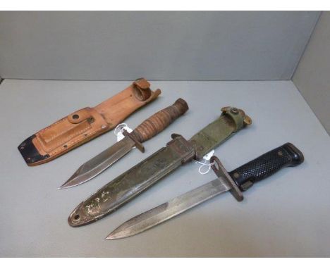 An American US 16A9 bayonet with metal scabbard with impressed mark US M8A1 and an Ontario Knife Company Survival Pilot knife