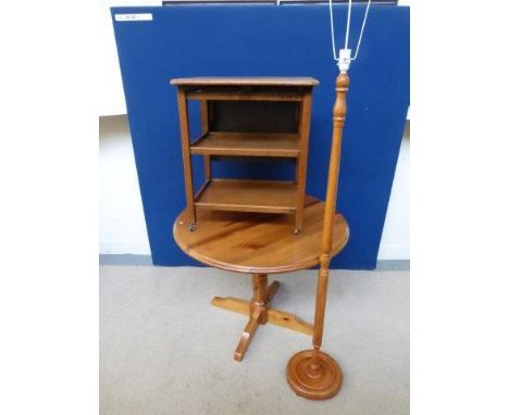 A pine circular kitchen table, an oak single dropleaf three tiered trolley and a pine standard lamp with shade. 