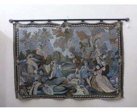 A needlework wall hanging tapestry depicting figures in an 18th Century classical scene. 