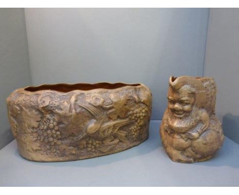 A relief mounted jug and planter, the jug decorated with a gnome. 