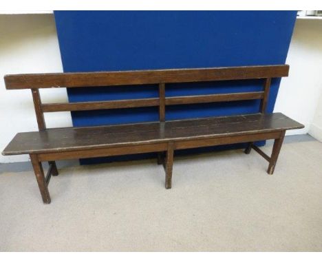 An oak railway style wooden plank bench. 