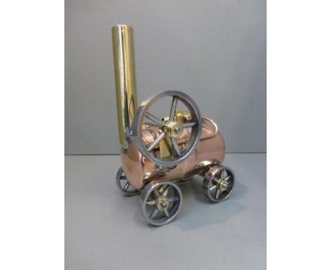 A brass and copper scratch built model of a traction engine. 
