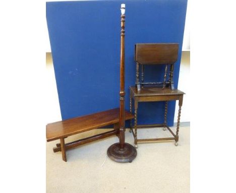 An oak bench, a side table, a sutherland table and an oak standard lamp. 