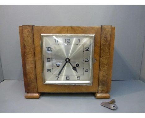 An Art Deco walnut mantle clock. 