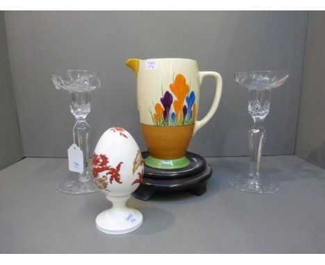 A Clarice Cliff Crocus patterned jug, a pair of Gleneagles crystal candle holders and a Crown Staffordshire ceramic egg on st