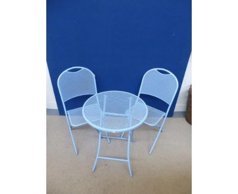 A patio set comprising a light blue metal folding table with two matching chairs. 