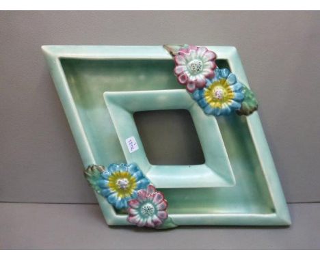 A Clarice Cliff lozenge shaped posy holder inscribed Clarice Cliff Wilkinson Ltd. England to the base. 