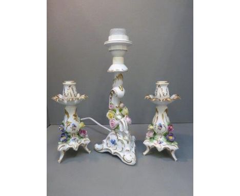 A pair of Dresden encrusted candlesticks and a similar lamp base. 