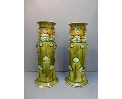 A pair of Art Nouveau Minton Ltd. circular tapering vases, marked to base Minton ltd. No. 22, 'B'.