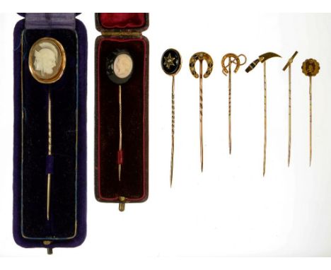 SEVEN GOLD STICKPINS, VARIOUS TERMINALS, ONE IN THE FORM OF A KNIFE WITH HARDSTONE HANDLE, ANOTHER SET WITH A CAMEO, A THIRD 