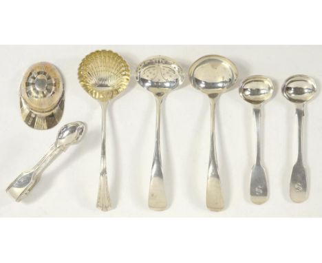 A GEORGE V SILVER SUGAR SIFTER AND A MATCHING CREAM LADLE, OLD ENGLISH PATTERN, SHEFFIELD 1934, ANOTHER SILVER SUGAR SIFTER W