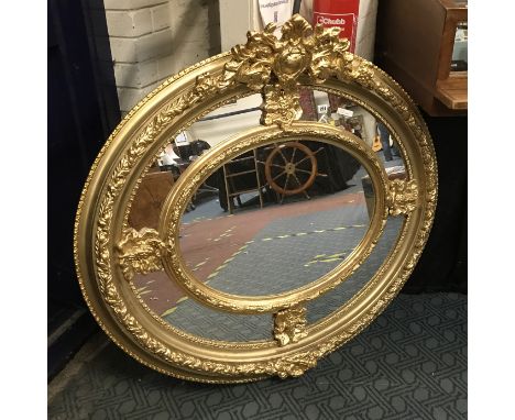 GILT WOOD OVAL MIRROR