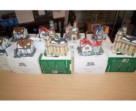 Nine ceramic, Christmas themed houses and others (All boxed)