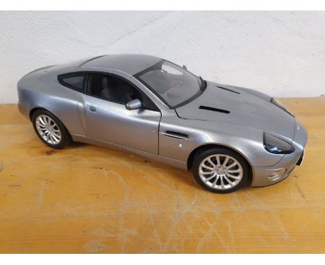 Die cast, scale 1:12, Kyosho for Danbury Mint Aston Martin Vanquish V12, limited edition James Bond "Die Another Day" with mo