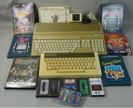 An Atari 520ST personal computer, with owner?s manual and power supply, together with an Acorn Electron computer and a quanti