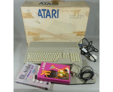 A boxed Atari 520STE Personal Computer, serial No. 3081305, complete with software instruction manual, MIDI and Sound Book fo