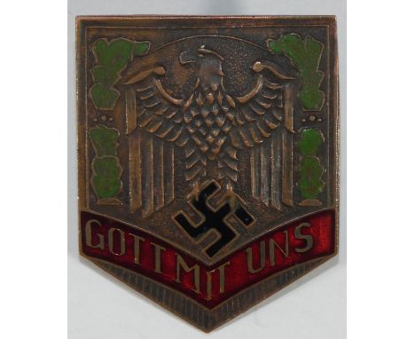 A German enamel 'Gott Mit Uns' metal badge, of shield shape, the reverse stamped GES GESCH, nut and bolt fitting, 4.5 x 3,5 c