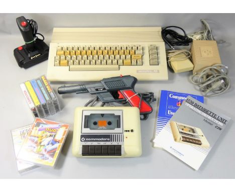 A boxed Commodore 64C 'Light Fantastic' computer and cassette unit, with various games, toolbox tape, light gun and a pair of