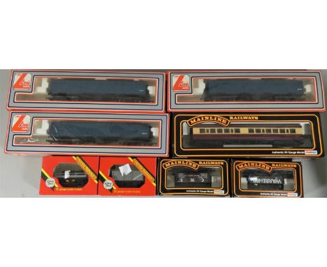 Eight boxed OO gauge carriages and wagons, to include Hornby R.208 GWR Shunters Wagon, R.217 BR Mineral Wagon, Mainline Railw