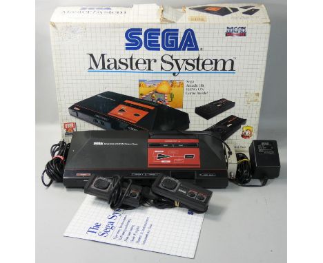 A boxed Sega Master System video game console, with pre-loaded arcade hit ?HANG ON?, appears complete with power base, contro