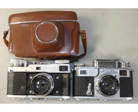 A rare Leningrad spring-wound 35mm camera, 1964, with matching screw-mount Jupiter 8 lens, case, together with a 1955 Kiev 35