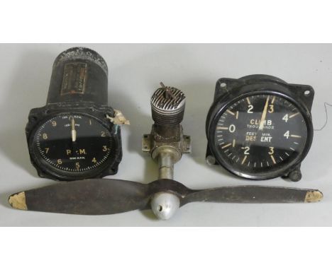An aircraft Indicator Mk IVB, a Climb/Descent meter and a model aircraft engine with propeller, serial number 4K731, 51 (3) 