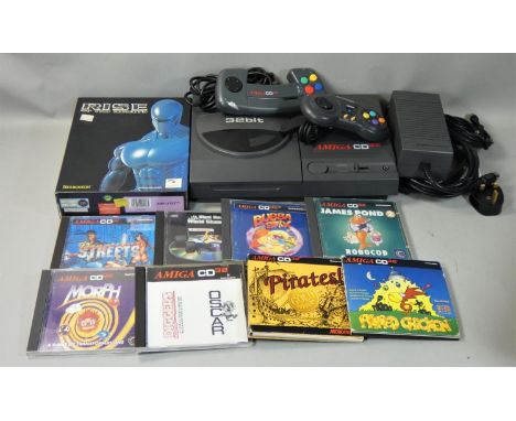 An Amiga CD 32 (32-Bit) game console, ID No. 513515, complete with PSU, TV lead, Commodore mouse, Amiga CD 32 controller, Log