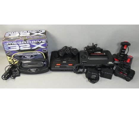 A Sega Mega Drive II 16-Bit game console, together with a "QuickShot II Plus" joystick, a "Cheetah Star Probe" joystick, two 