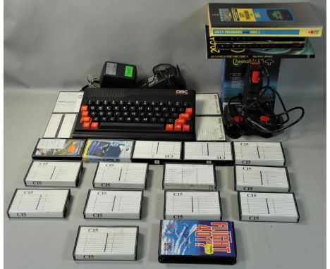 An Oric Atmos 48K personal computer, with Atmos manual, together with a Cheetah 125+ joystick and a quantity of cassette tape