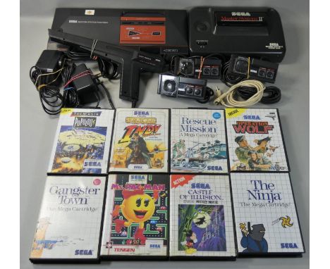 A Sega Master System II game console, with Sega Master System Power Base, complete with three control pads, AC mains adapters