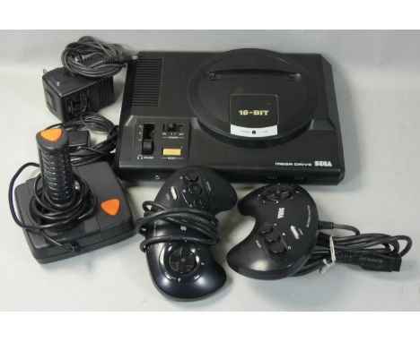 A Sega Mega Drive 16-Bit game console, together with a joystick, two control pads, AC mains adapter and Sega RF switch. 