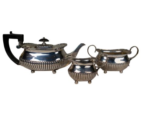 British 20th Century A silver tea set, including teapot, milk jug and sugar bowl Hallmarked William Hutton &amp; Sons  Approx