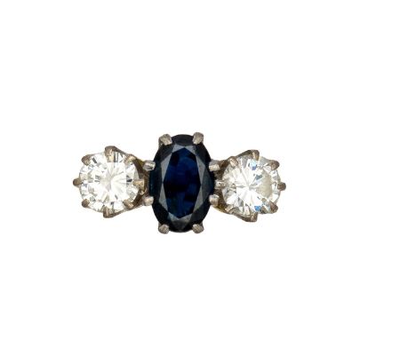 British Circa 1950 A three stone sapphire and diamond ring mounted in 18 carat yellow gold and platinum&nbsp;   Weight: Appro