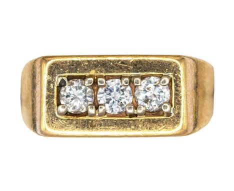 American Circa 1970 A diamond three stone and yellow metal dress ring  Ring size: Q Weight: Approx. 10 grams 
