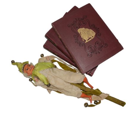 Early 20th Century Three copies of Punch, with a marotte jester puppet Do not feed him after midnight The hardback Punch maga