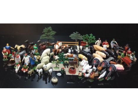 Britains farmyard figures and animals including milkmaids, shepherds, tractor drivers, pigs, sheep, turkeys, hens, geese, tro