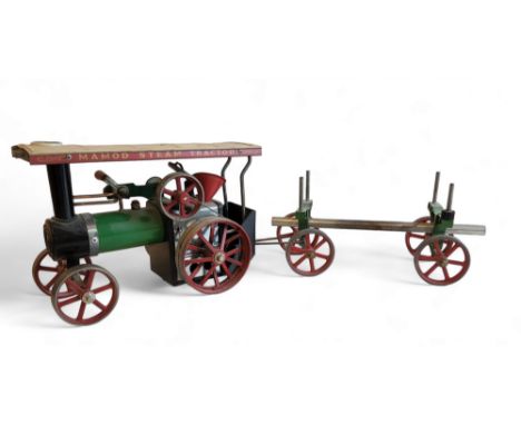 A Mamod TE1A live steam traction engine, with log trailer. 