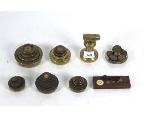 A brass 2lb bell weight and a large collection of various other brass and other scale weights 