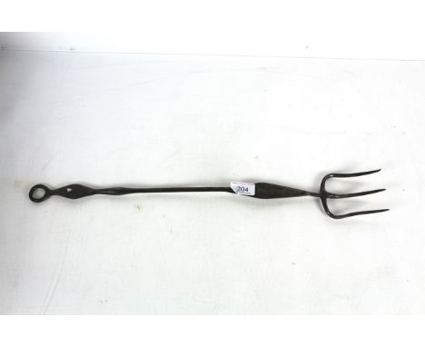 A large 18th Century steel three pronged toasting fork with lozenge shaped decoration Measuring approximately 22" long