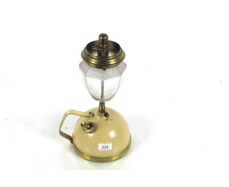 A Tilley table lamp with brass mounts, decorative glass shade and with a short stem and handle