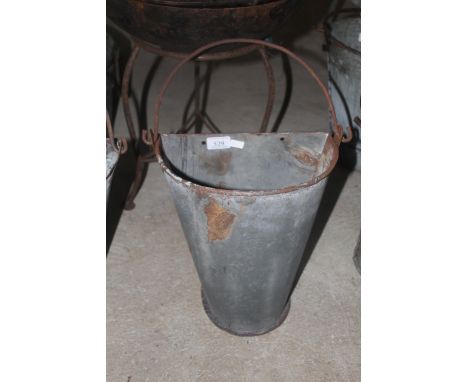 A bucket wall planter with swing handle